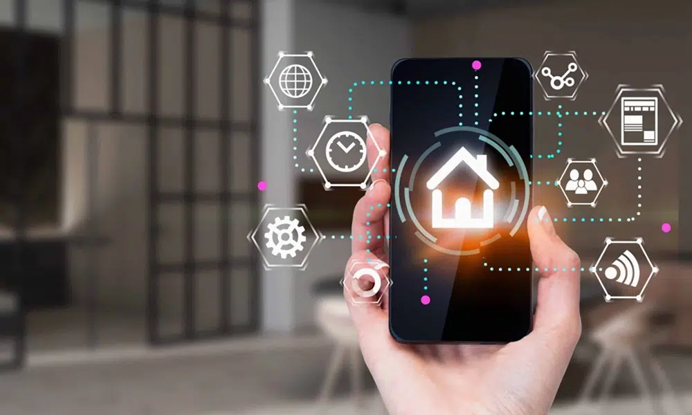 A person holds a cellphone. Apps are digitally illustrated floating out to the side.